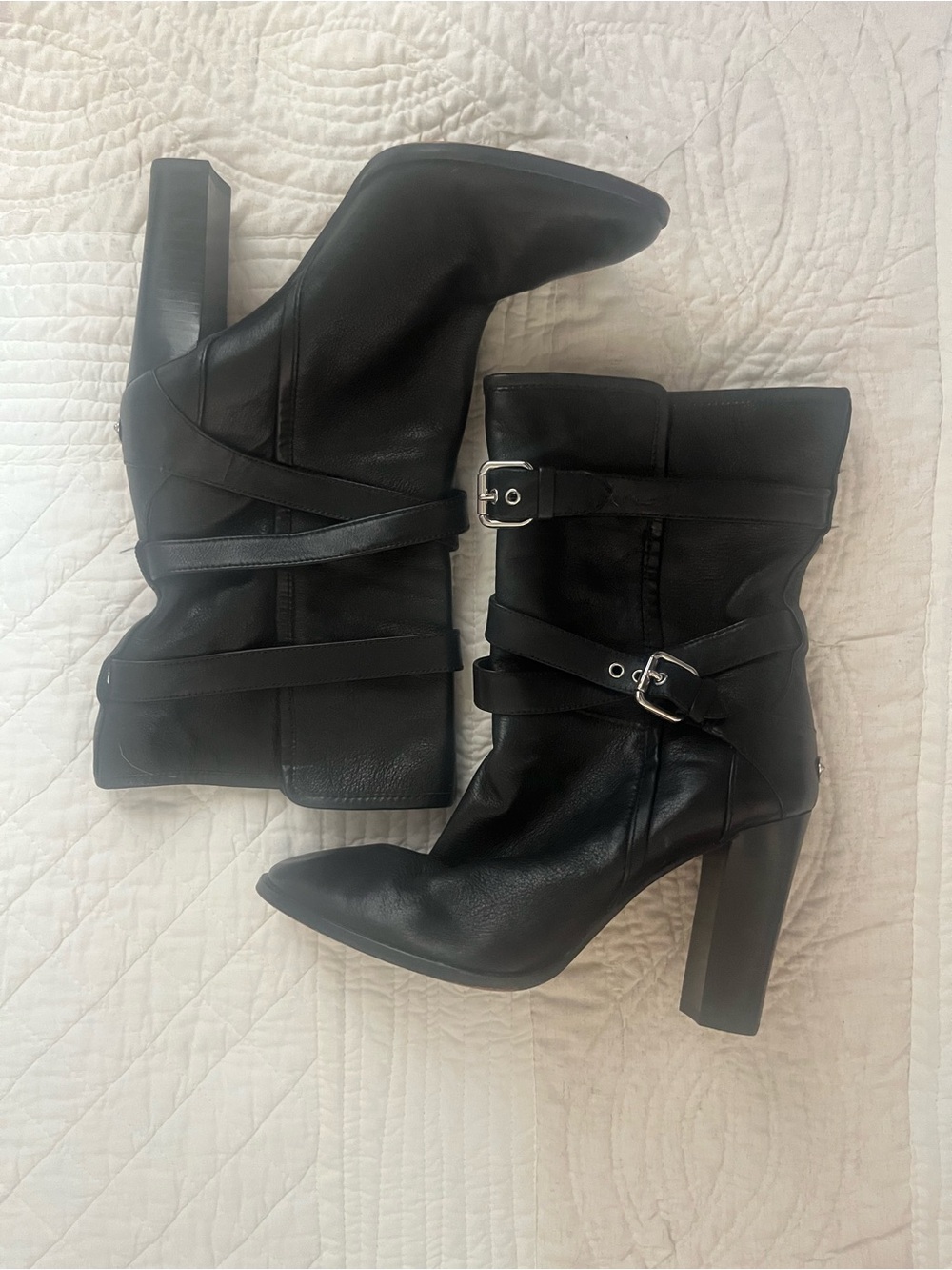 Coach calf block heel boots with straps and block heels.